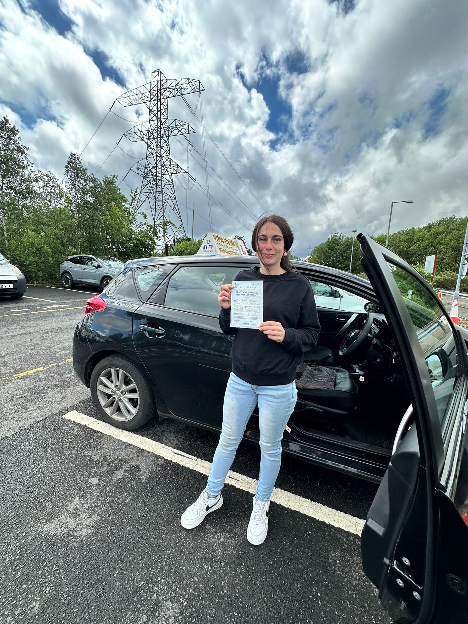 Learner celebrating a driving test pass with Sara