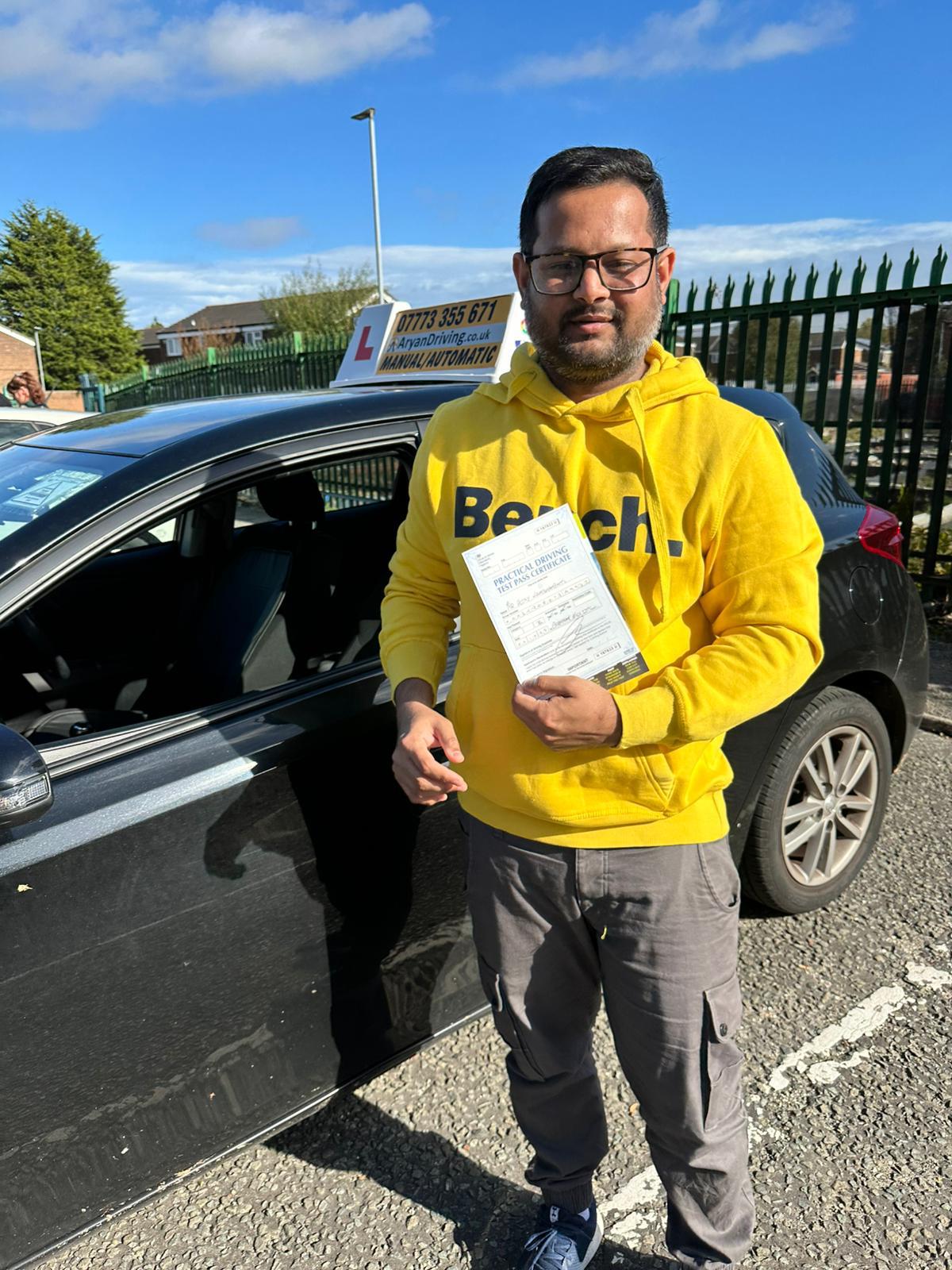 Learner celebrating a driving test pass with Sara