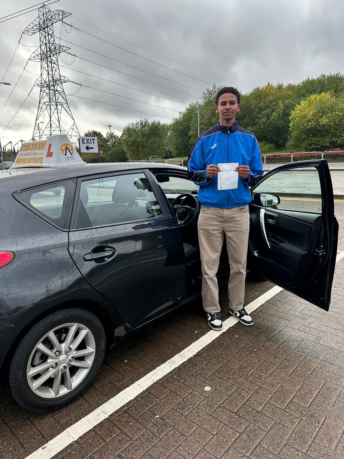 Learner celebrating a driving test pass with Sara