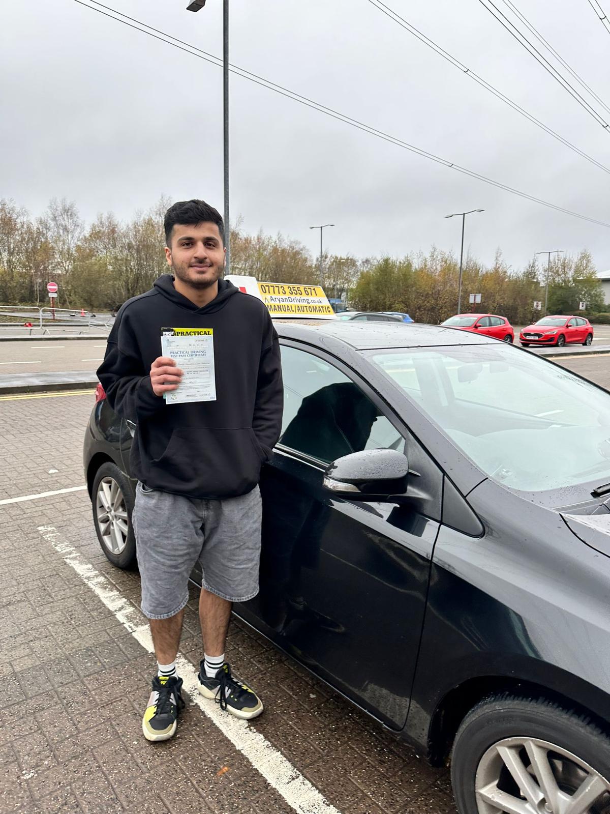 Learner celebrating a driving test pass with Sara