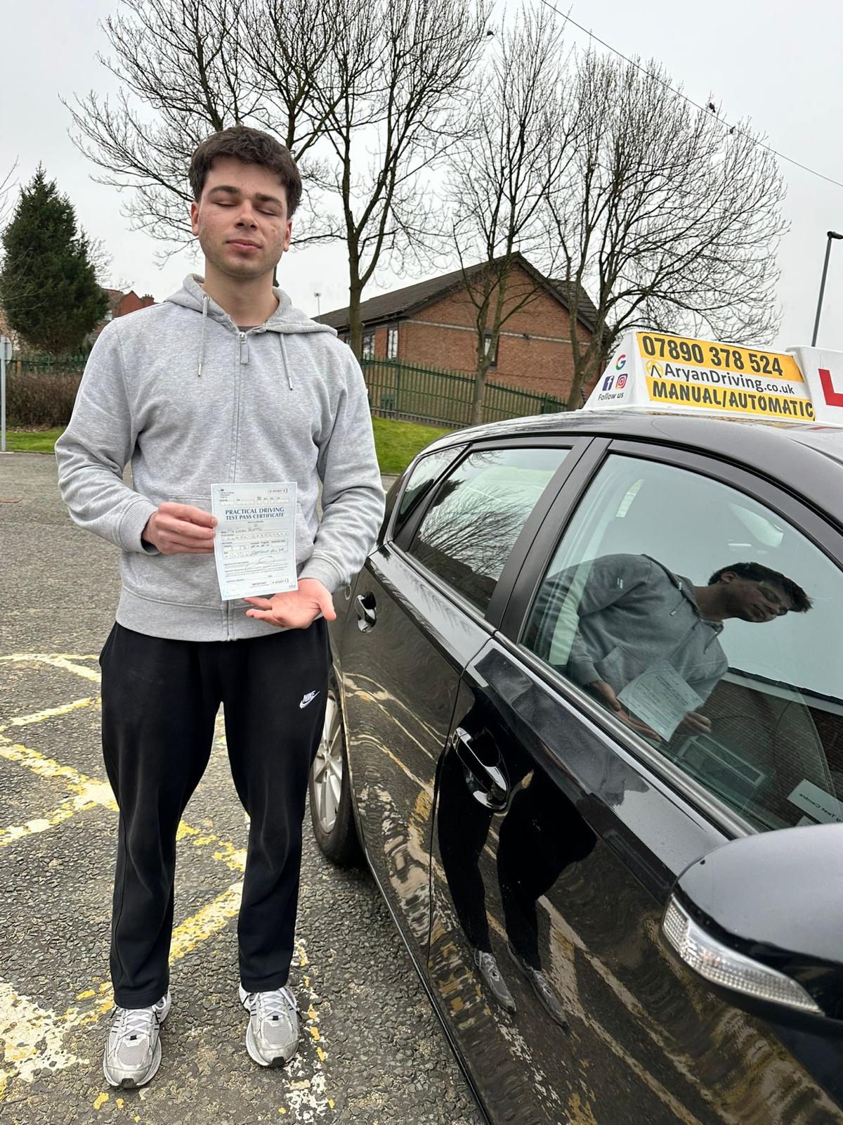 Learner celebrating a driving test pass with Sara