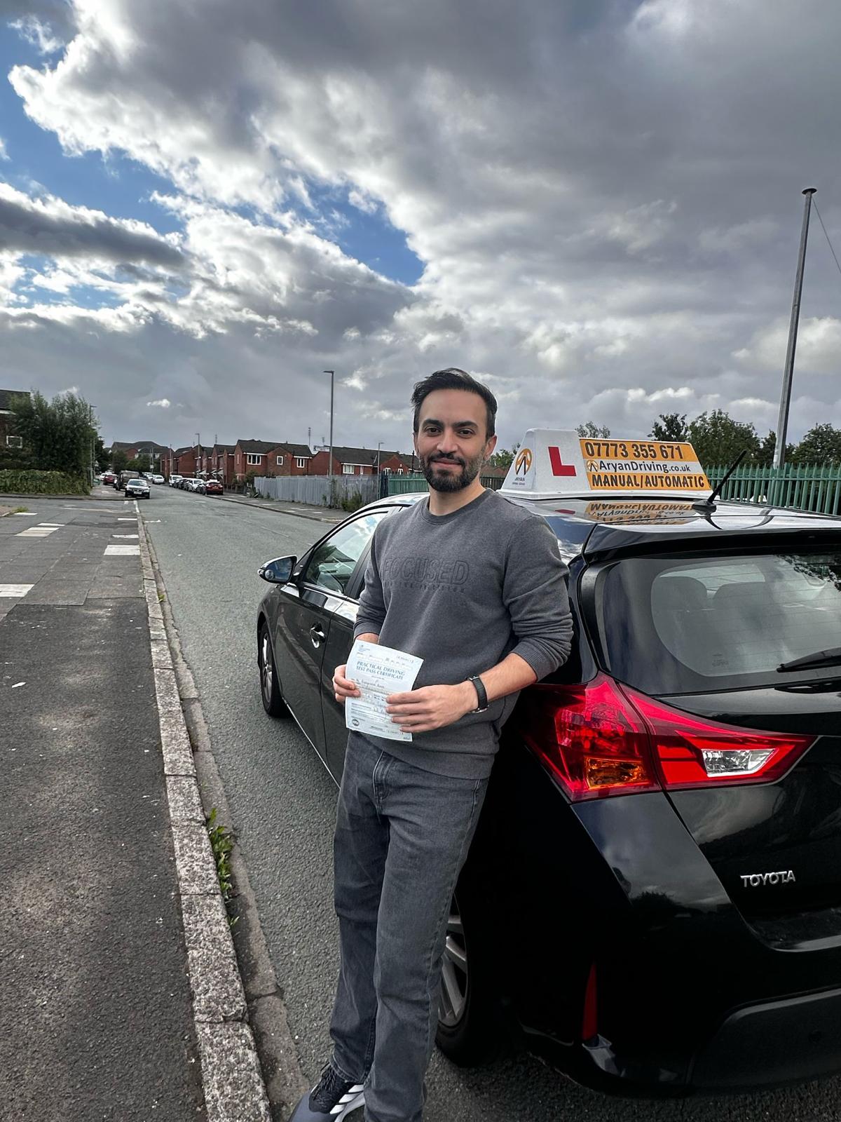Learner celebrating a driving test pass with Sara
