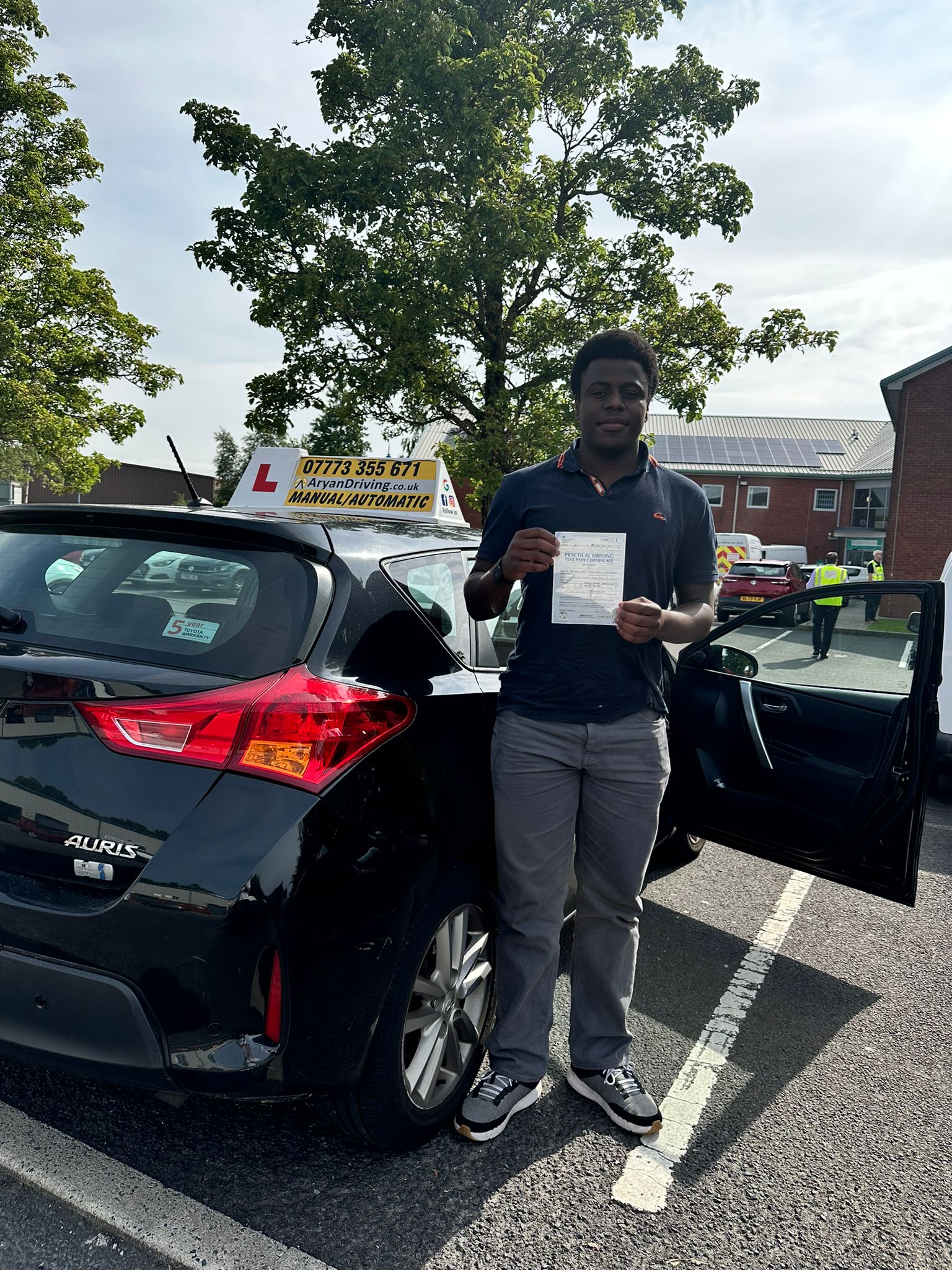 Learner celebrating a driving test pass with Sara