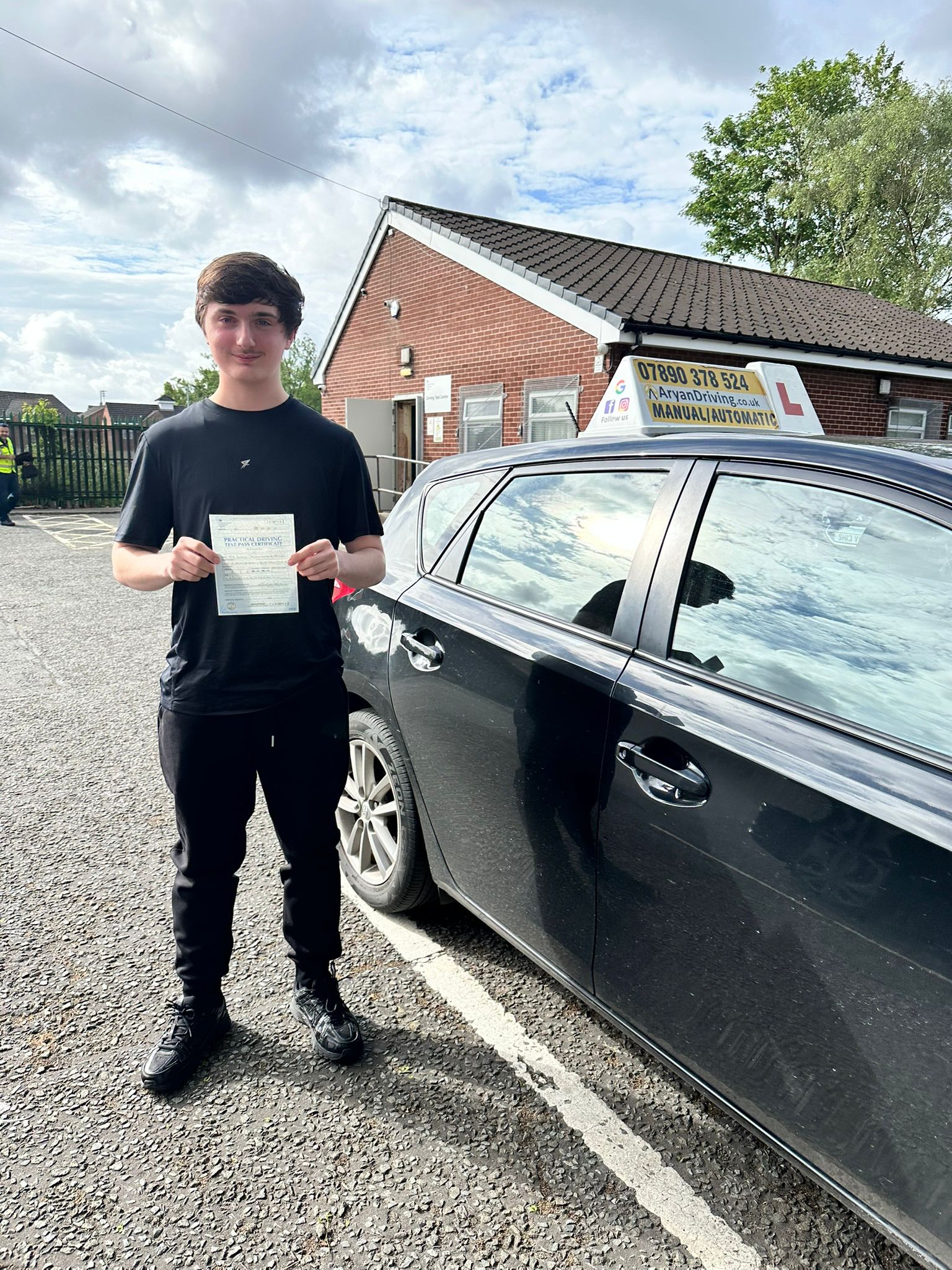 Learner celebrating a driving test pass with Sara