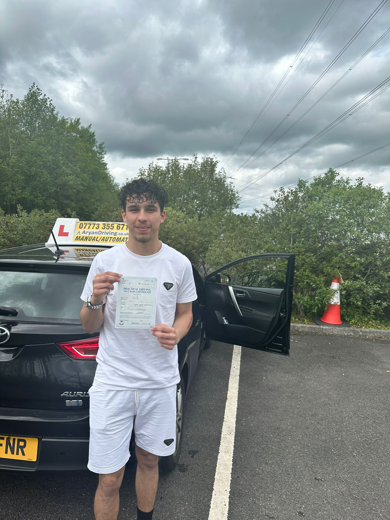 Learner celebrating a driving test pass with Sara