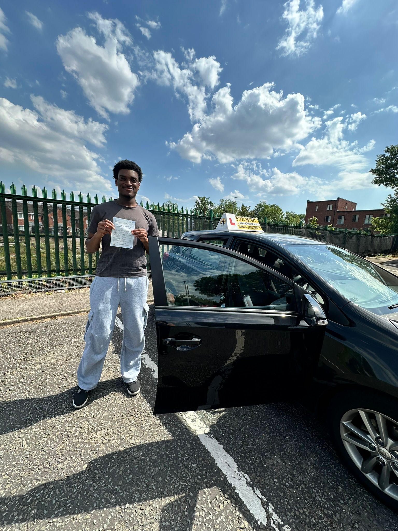 Learner celebrating after passing a driving test