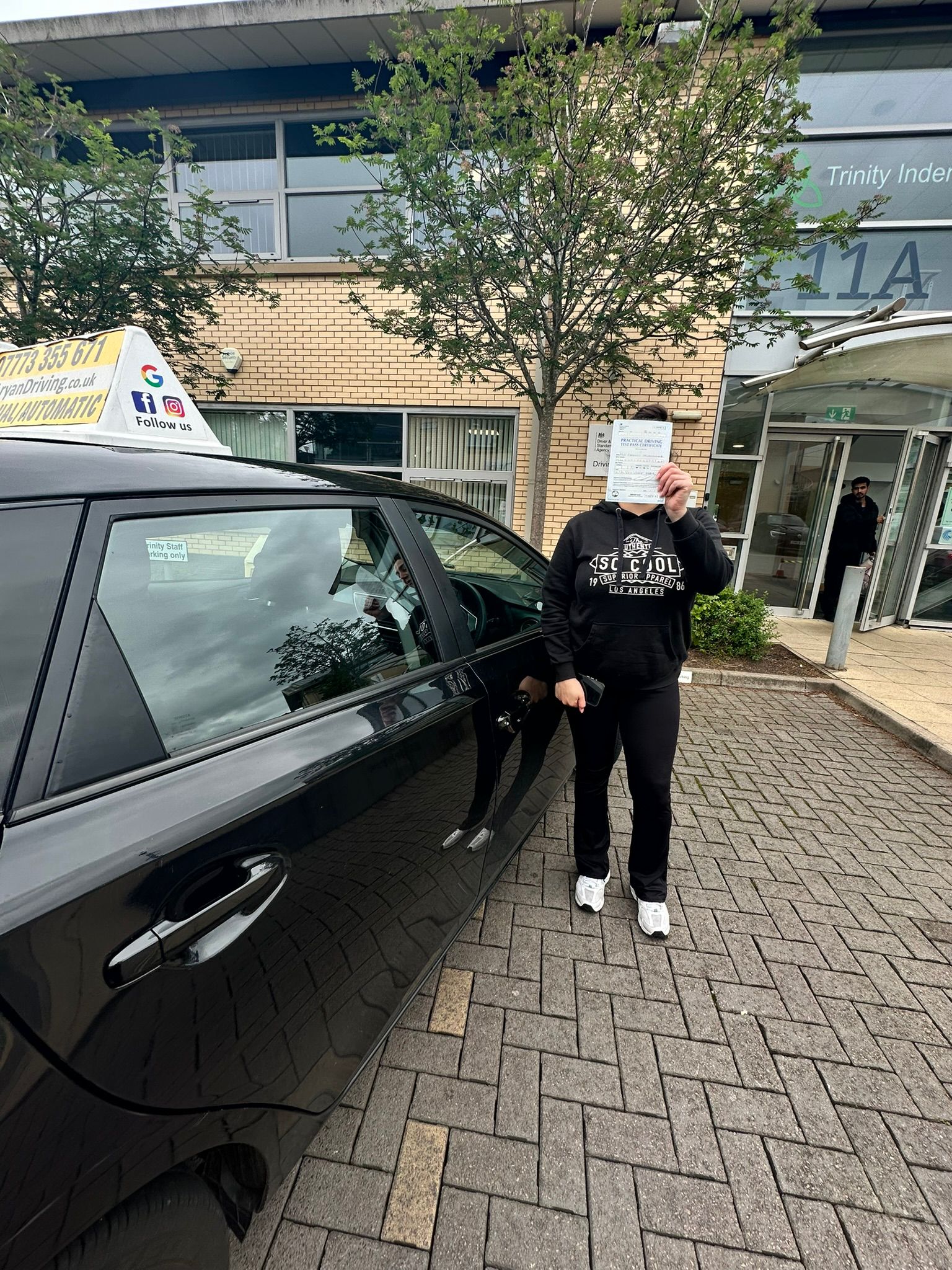 Learner celebrating a driving test pass with Sara