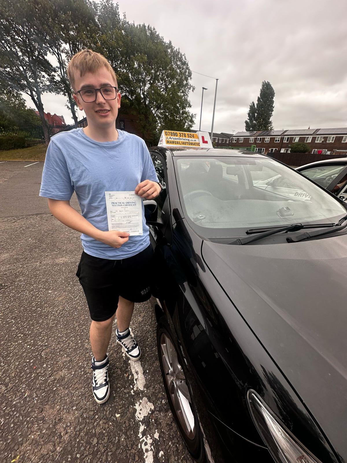 Learner celebrating a driving test pass with Sara